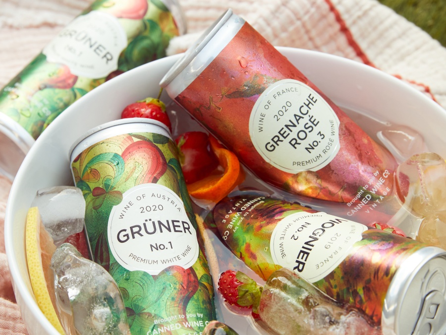 Canned Wine Co. cans in an ice bucket on a picnic blanket